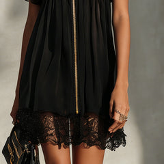 Black mini dress with gold front zipper and lace hem trim