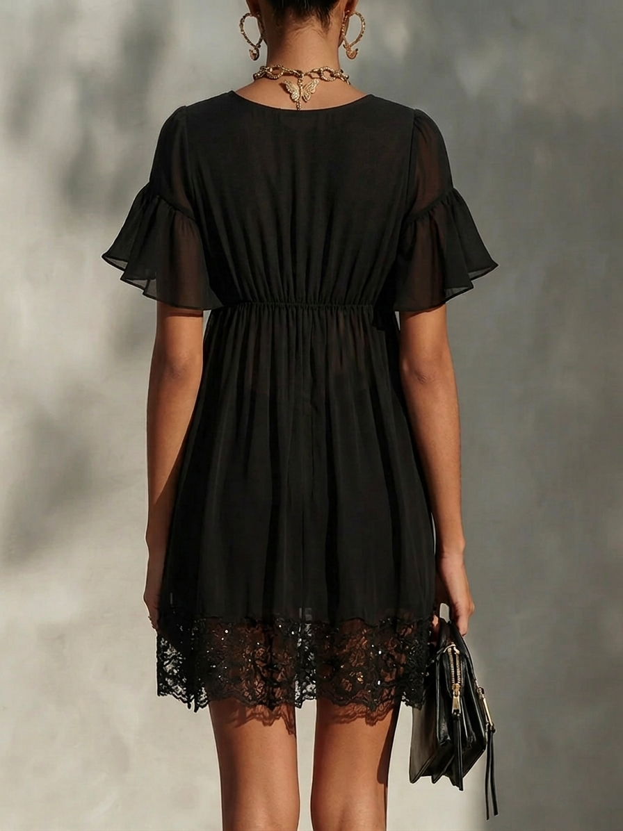 Black lace-trim mini dress back view with short flutter sleeves and gathered waist