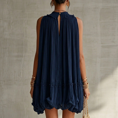 Navy chiffon halter mini dress with pleated back and tiered ruffled hem