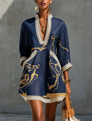 Navy mini dress with V-neck crochet lace trim and gold abstract print, long sleeves