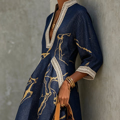 Aurelia crochet lace mini dress in navy with gold motif, V-neck and lace trim.
