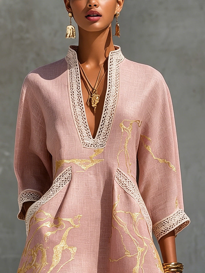 Aurelia crochet lace mini dress in pink with gold V detail and lace trim on neckline.