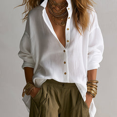 Two-piece linen set: white linen blouse with gold buttons over olive drawstring pants