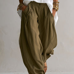 Two-piece linen set: olive drawstring pants with patch pockets and white button-up blouse