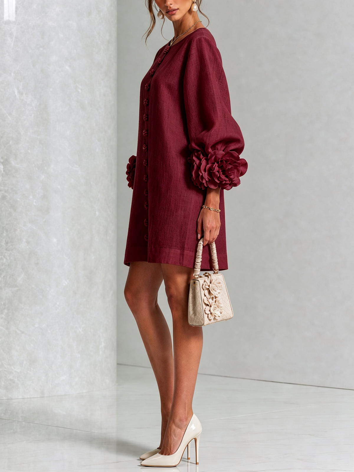 Burgundy button-down mini dress, side view, with vertical buttons and flowered puff sleeves