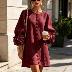 Burgundy button-down mini dress with vertical buttons and rose-like sleeve accents