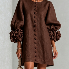 Dark brown button-down mini dress with long sleeves and embroidered button front and rosette cuffs