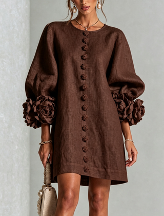 Dark brown button-down mini dress with long sleeves and embroidered button front and rosette cuffs