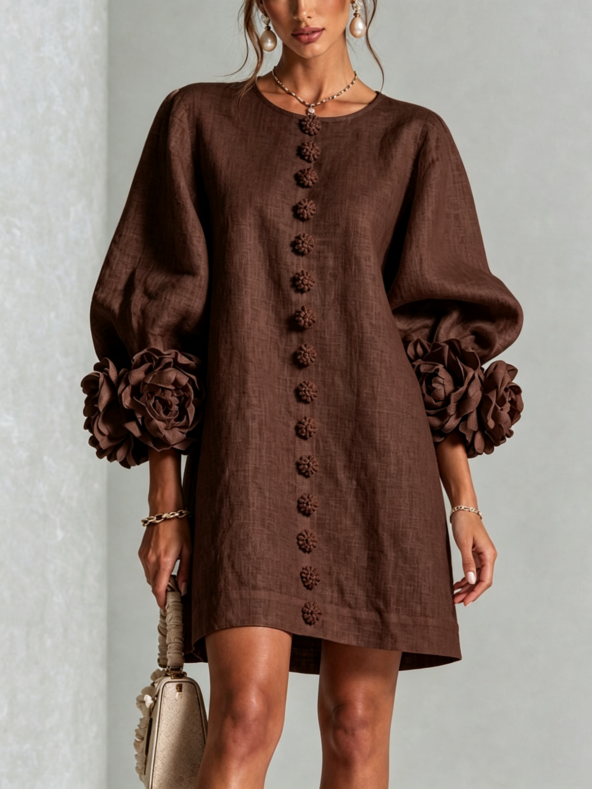Dark brown button-down mini dress with long sleeves and embroidered button front and rosette cuffs