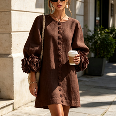 Dark brown button-down mini dress with long sleeves, embroidered button front, and rosette cuffs