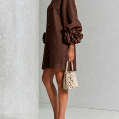 Dark brown button-down mini dress with long sleeves and rosette cuff accents