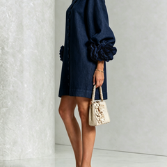 Navy button-down mini dress with side view, vertical buttons, and rosette puff sleeves