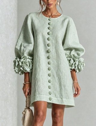 Sage green button-down mini dress with vertical button placket and ruffled sleeve flowers