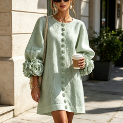 Sage green button-down mini dress, front view, with vertical buttons and flowered sleeves