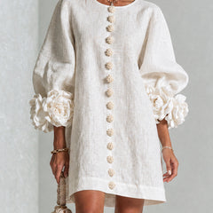 White button-down mini dress with vertical gold button placket and puff sleeves
