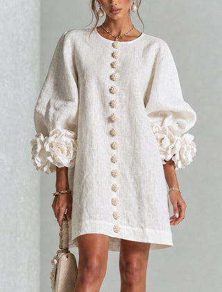 White button-down mini dress with vertical gold button placket and puff sleeves