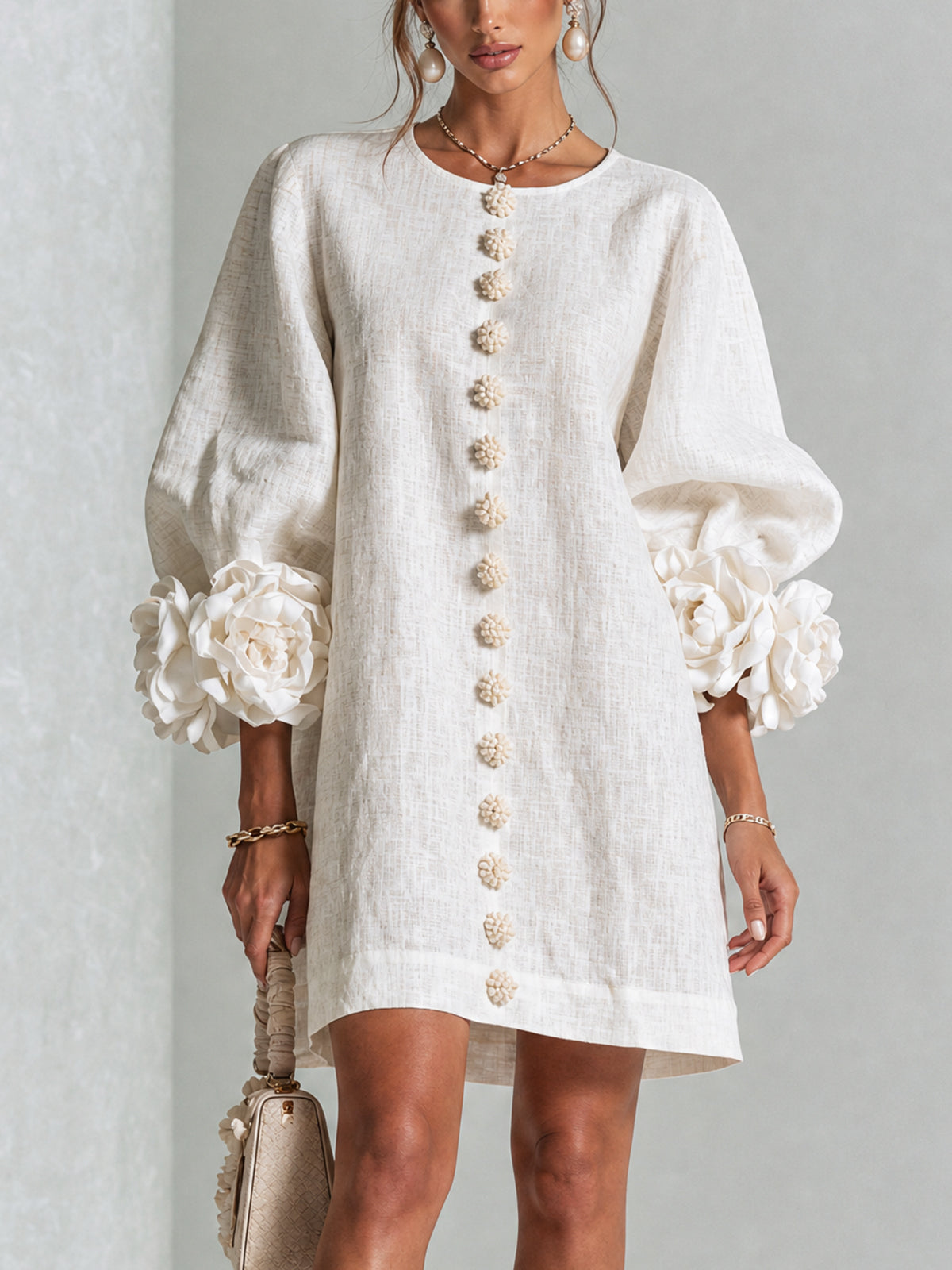 White button-down mini dress with vertical gold button placket and puff sleeves