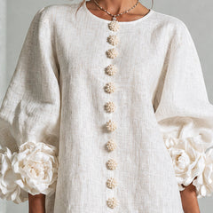 White button-down mini dress with vertical gold button placket and round neckline