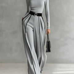 Grey high-neck long-sleeve top and wide-leg pants set with white trim and waist belt buckle.
