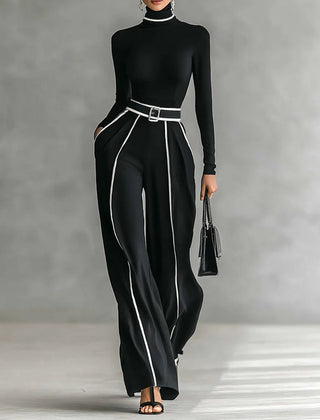 Black high-neck long-sleeve top and wide-leg pants set with white trim and waist belt buckle.