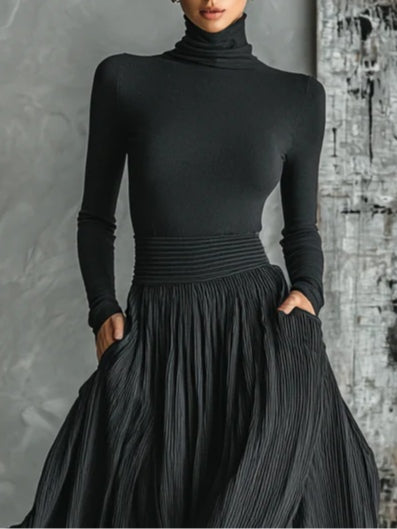 Black long-sleeve turtleneck top with gathered waist pleated midi skirt