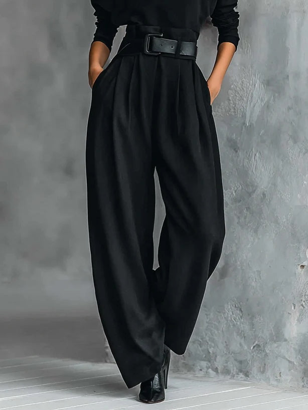 Black belted wide-leg pants with pleated front and adjustable waist buckle