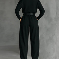 Black two-piece set, back view: turtleneck top with belted waist and wide legs