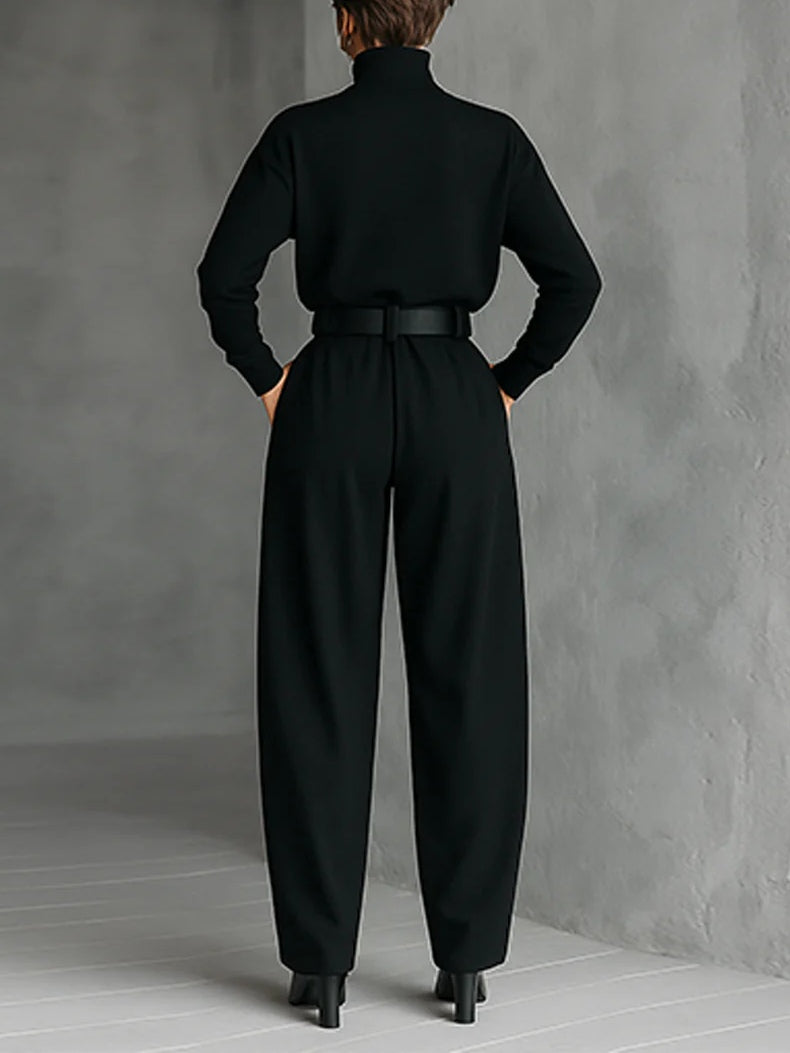 Black two-piece set, back view: turtleneck top with belted waist and wide legs