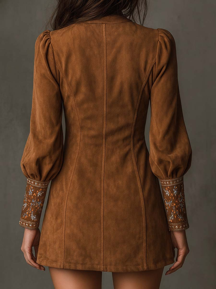 Brown suede mini dress back view with gathered shoulders and long puff sleeves