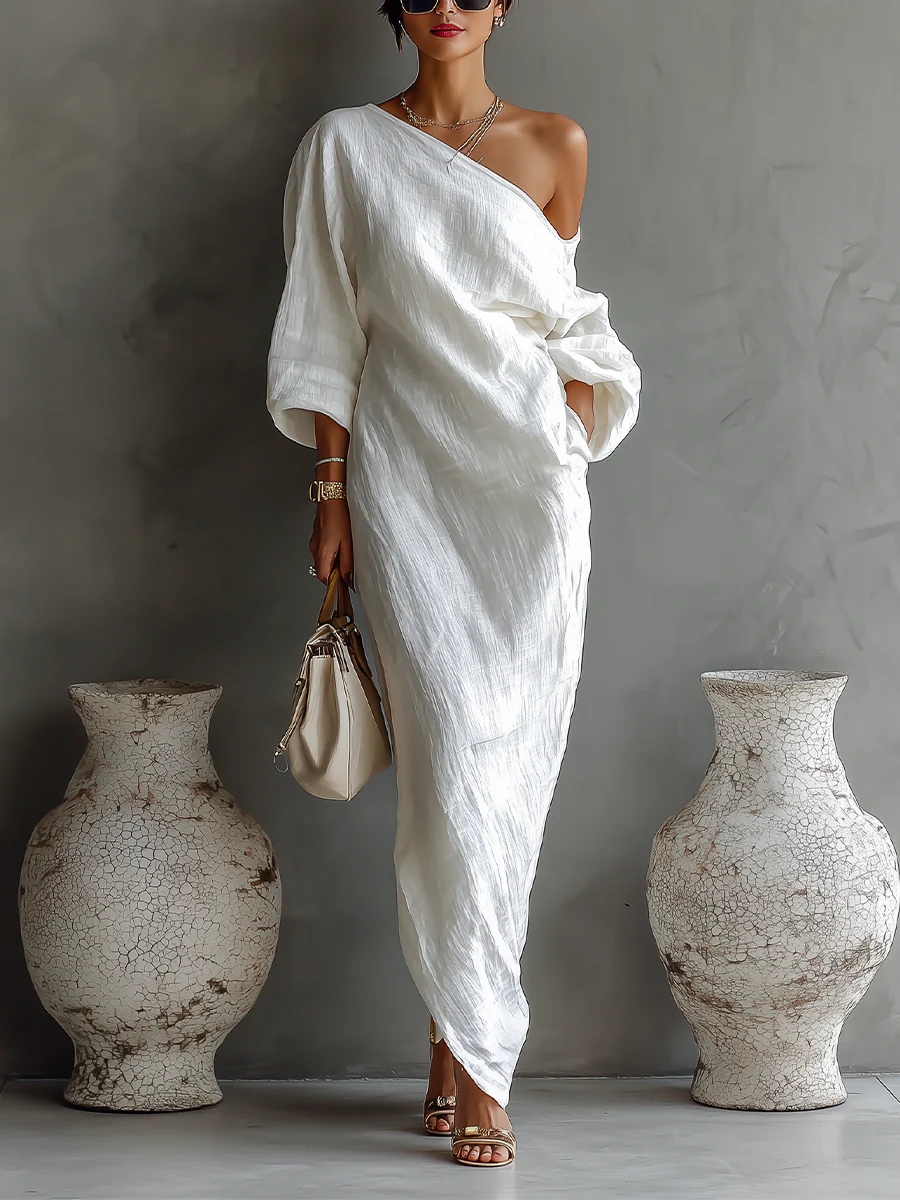 White one-shoulder maxi dress with draped sash and three-quarter sleeves