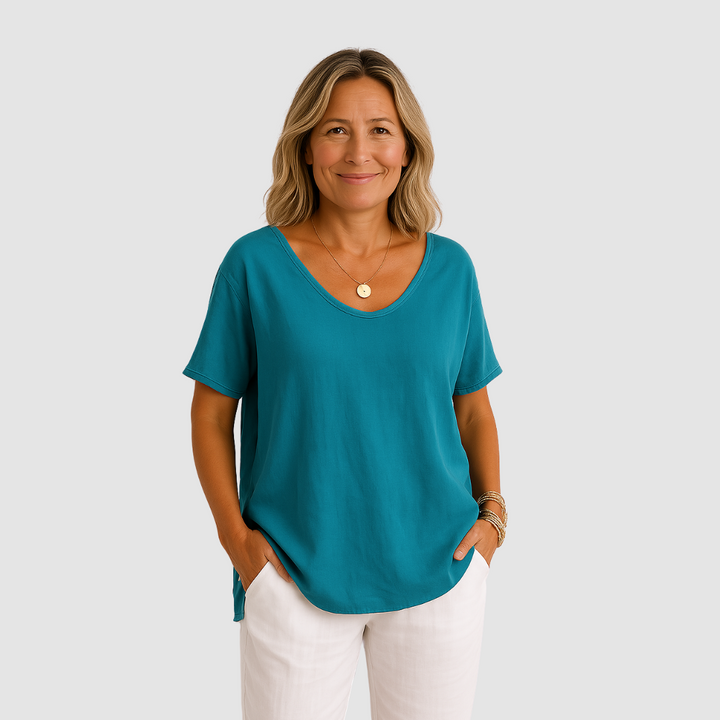 Teal blue loose-fit T-shirt with V-neck and short sleeves, relaxed drape