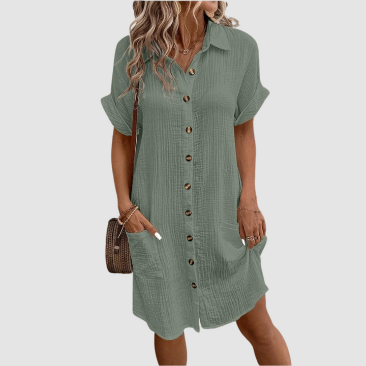 Green relaxed-fit shirt dress with short sleeves, point collar, and button-front placket.