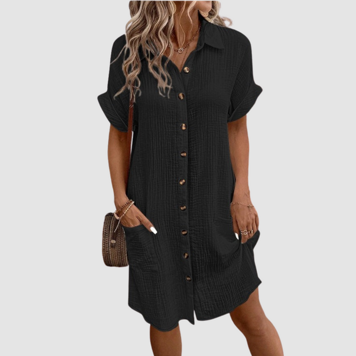 Black relaxed-fit shirt dress with short sleeves, point collar, and button-front placket.
