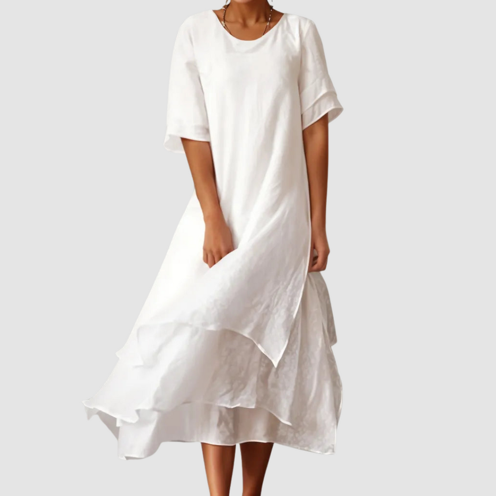 White loose midi dress with short sleeves and layered ruffle hem
