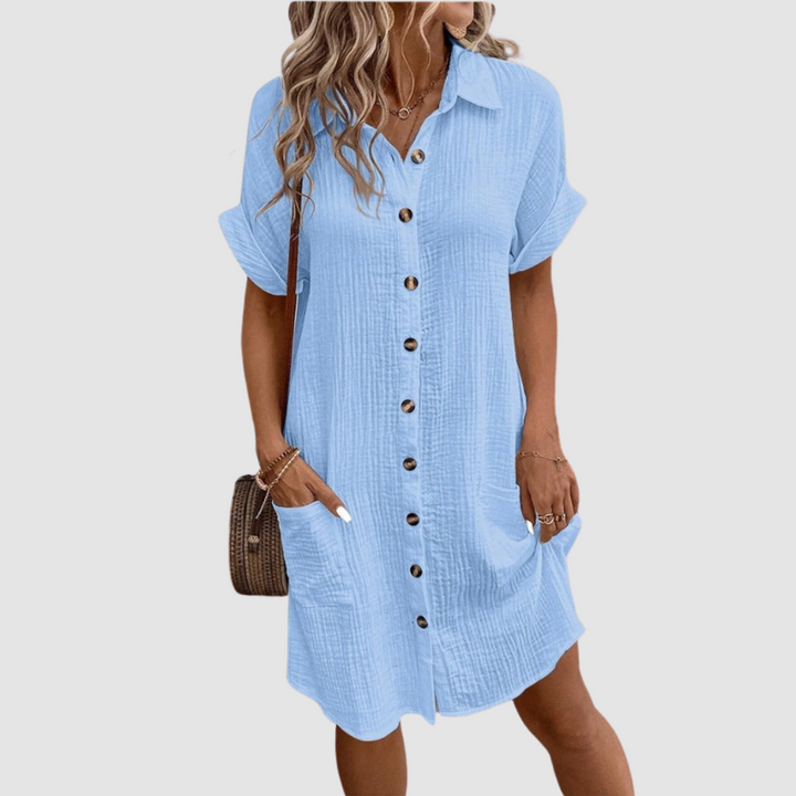 Blue relaxed-fit shirt dress with short sleeves, point collar, and button-front placket.