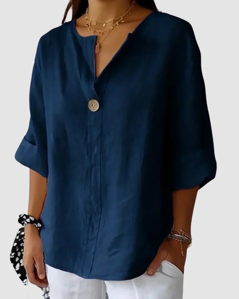 Blue classic blouse with V-neck, button front, and short cuffed sleeves