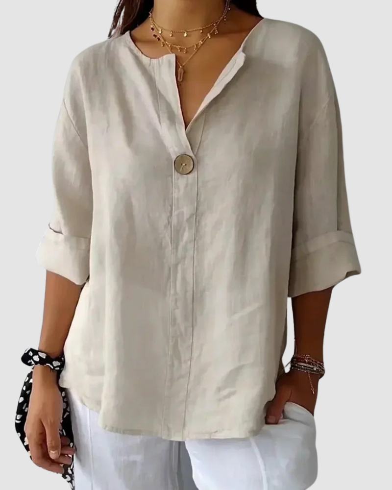Light beige classic blouse with V-neck, button front, and 3/4 rolled sleeves