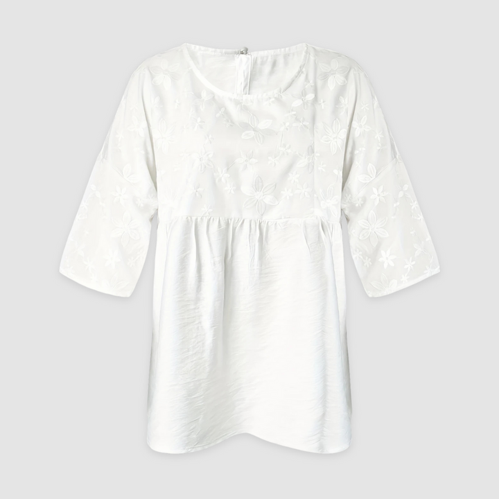 White loose-fit tunic shirt with round neck, three-quarter sleeves, floral pattern