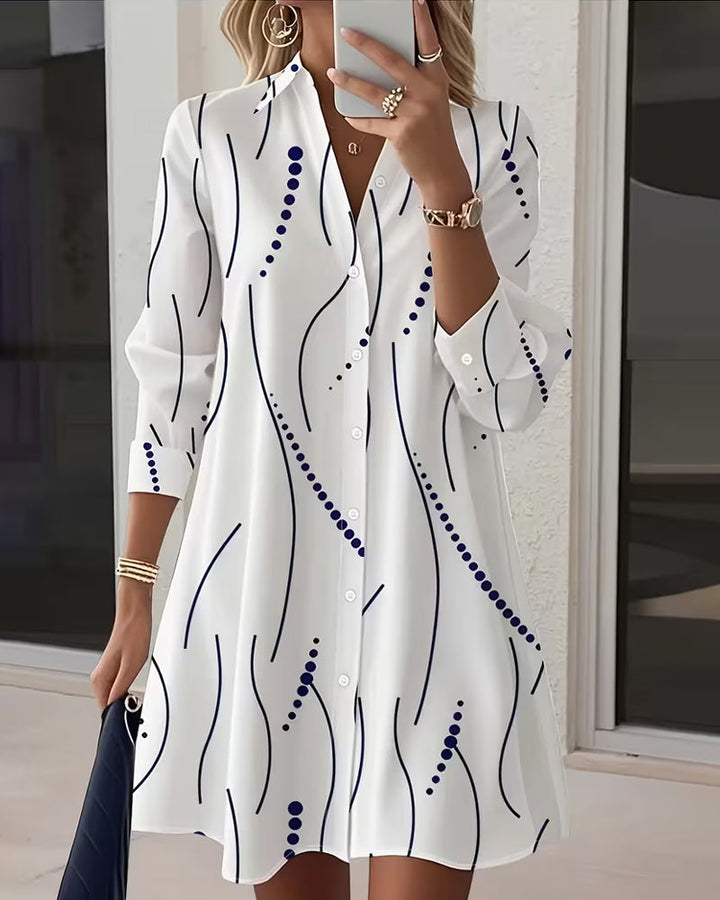Women's white button-front wavy-collar shirt with navy lines and blue dot pattern