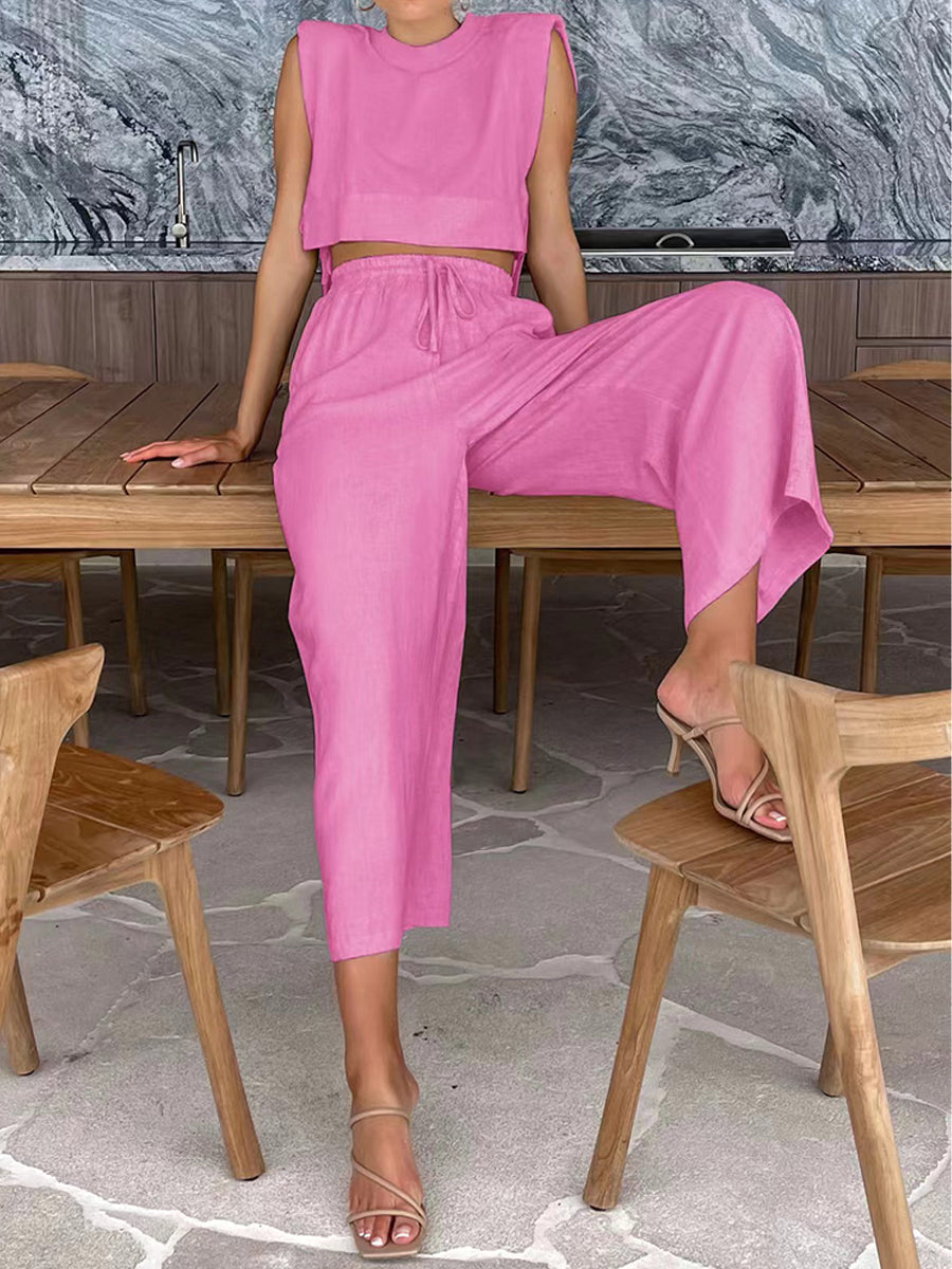 Pink two-piece set: sleeveless crop top and drawstring wide-leg pants, ankle-length.