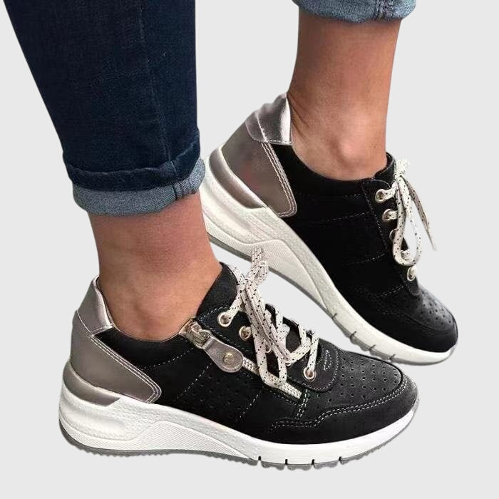 Black orthopedic sneakers with lace-up, perforated uppers and padded collar