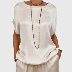 White satin two-piece set with short-sleeve top and drawstring wide-leg pants