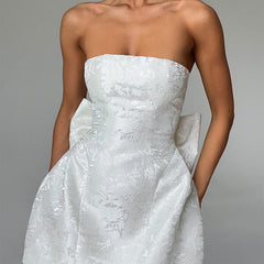 White strapless jacquard mini dress with structured bodice and flared skirt