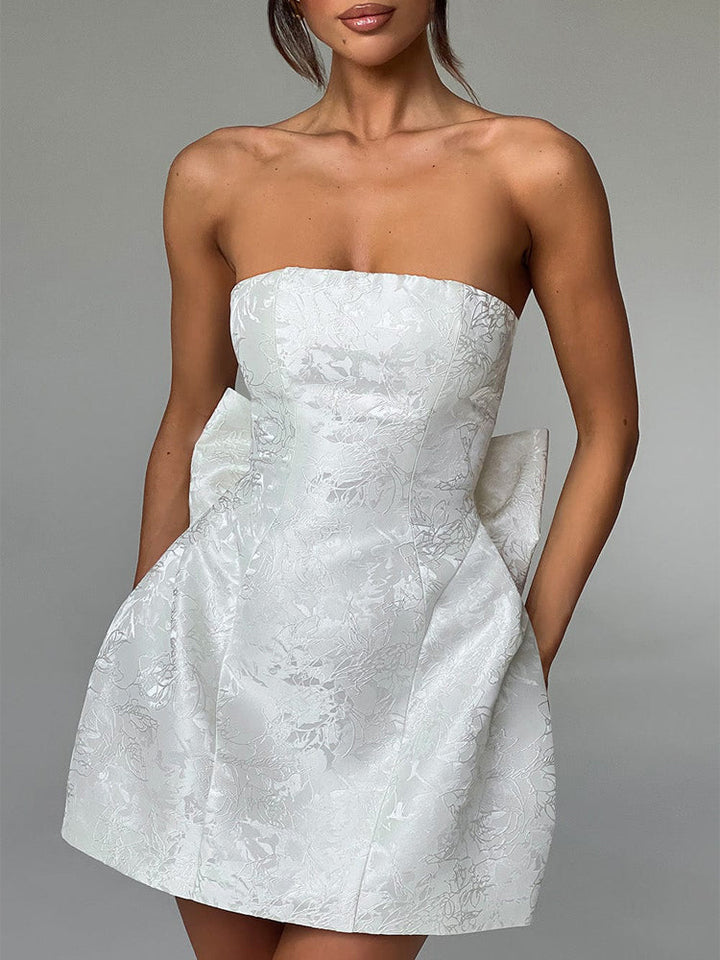 White strapless jacquard mini dress with structured bodice and flared skirt