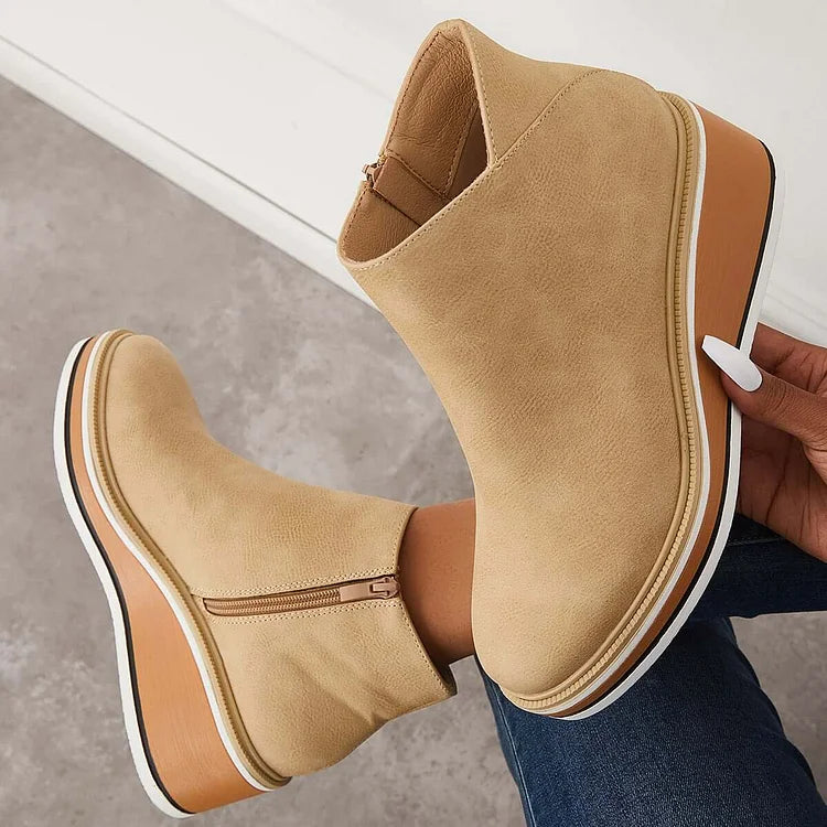 Tan suede-look ankle boots with side zipper and tan platform wedge with white sole