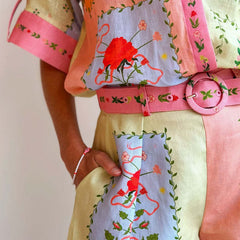 Patchwork shorts with floral embroidery and pink belt tie, cream and pastel multicolor