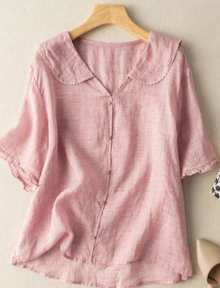 Light pink cotton short-sleeve blouse with scalloped collar and button front