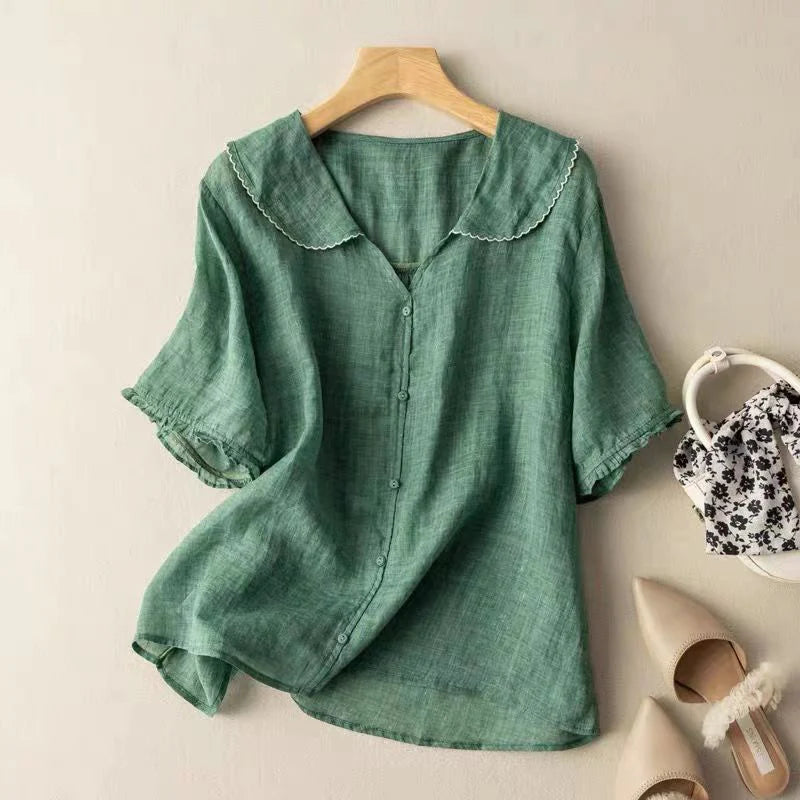 Green short-sleeve cotton blouse with scalloped collar trim and center button front