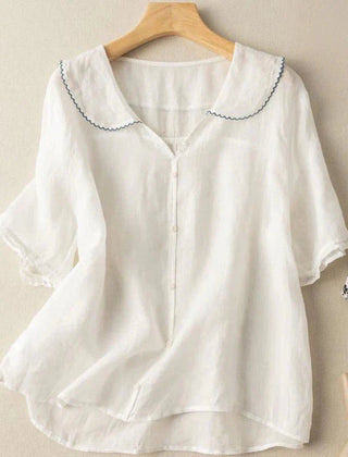 White cotton short sleeve blouse with scalloped peter pan collar and button front