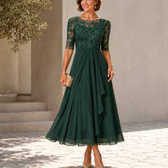 Green lace midi dress with 3/4 sleeves, fitted waist and layered chiffon skirt